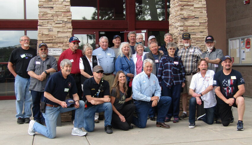 Members of Evergreen Fire/Rescue past and present pose for a photo outside the Administration Building.